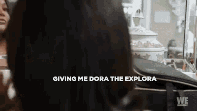 a woman is looking at her reflection in a mirror with the words giving me dora the explore written below her