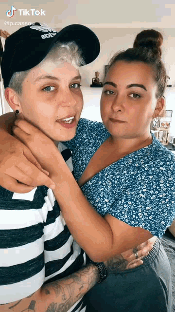 two women are posing for a picture and the caption reads tiktok