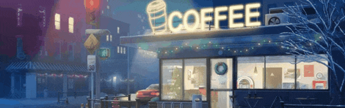 a coffee shop is lit up at night with a cup of coffee in the window