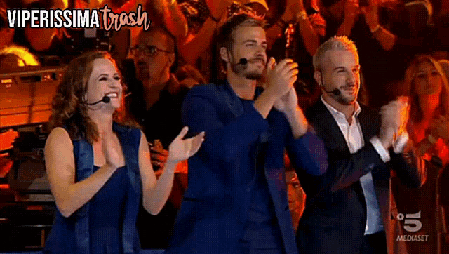 a group of people applauding in front of a crowd with the words viperissima trash on the bottom
