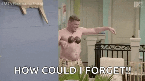a shirtless man in a hula outfit is dancing in a living room with the words `` how could i forget '' .