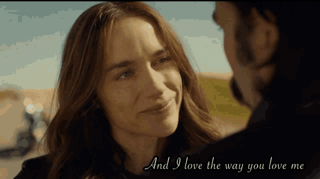 a man and a woman are looking at each other with the words and i love the way you love me