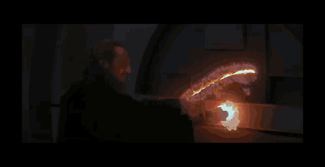 a dark room with a fire coming out of a hole