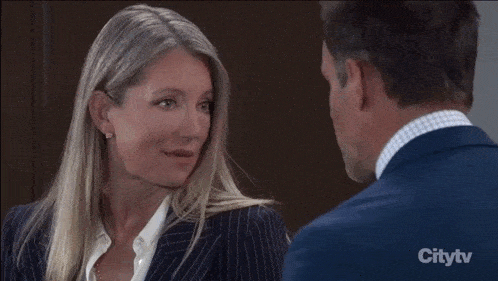 a woman says i don 't think so in front of a man in a suit
