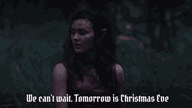 a woman is laying in the grass with the words we can 't wait tomorrow is christmas eve