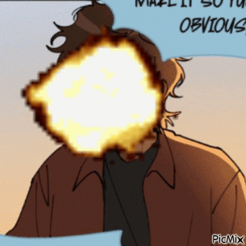 a man with a fireball in front of his face .