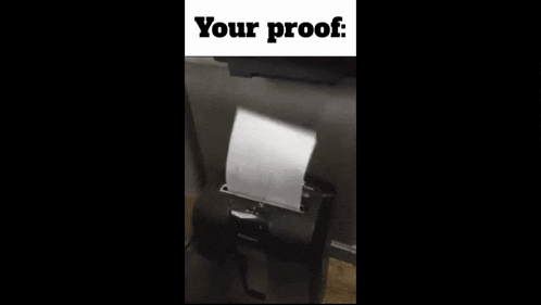 a piece of paper is coming out of a paper shredder with the words " your proof " written above it