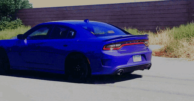 a purple dodge charger with a california license plate
