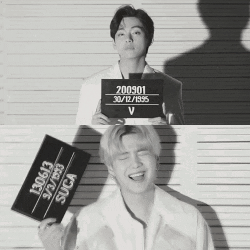 a black and white photo of a man holding a sign that says 2000301