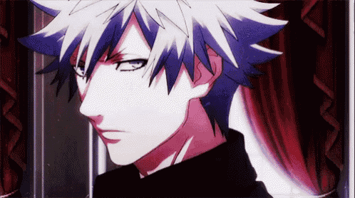 a close up of a anime character 's face with a red curtain behind him .