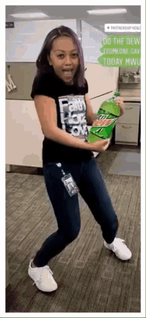 a woman with purple hair is holding a bottle of mountain dew and a bag of chips .