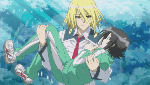 a boy is carrying a girl in his arms and the girl is wearing green pants