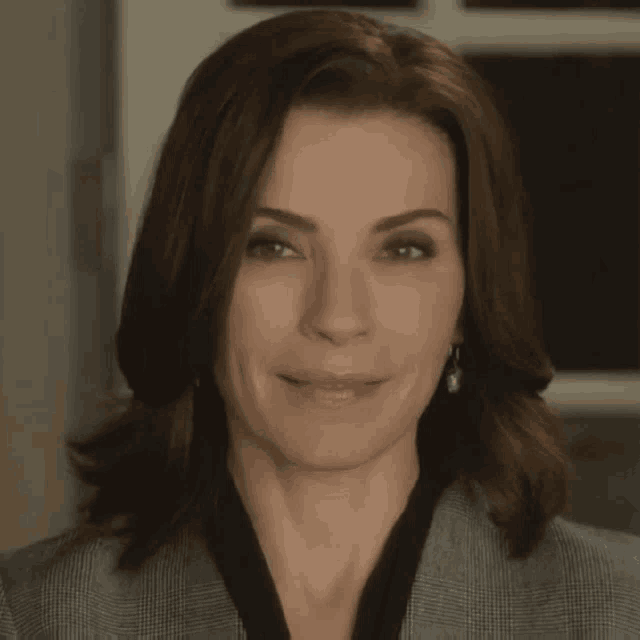 a close up of a woman 's face with brown hair