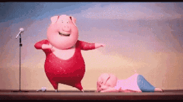 a cartoon pig is dancing on a stage next to another pig