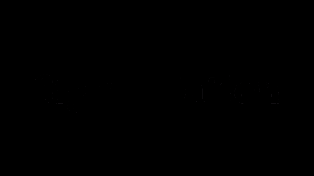 a close up of a tiger 's face in the dark with trees in the background