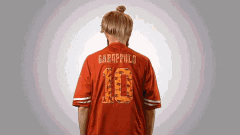 a person wearing a red jersey with the number 10 on it
