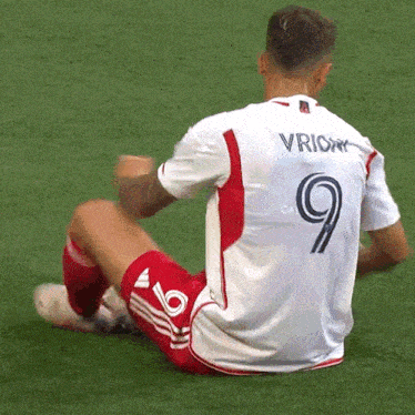 a soccer player with the number 9 on his jersey