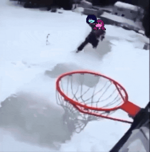 a person is playing basketball in the snow with a cartoon character on their head