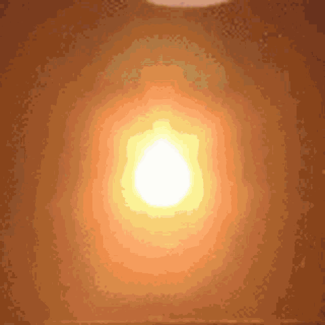 a close up of a light bulb on a wall