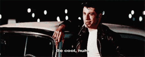 a man in a leather jacket is leaning on a car and smoking a cigarette and saying be cool huh