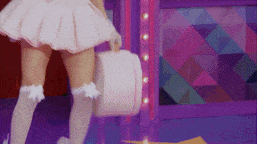 a woman in a pink skirt and white knee high socks is holding a white box