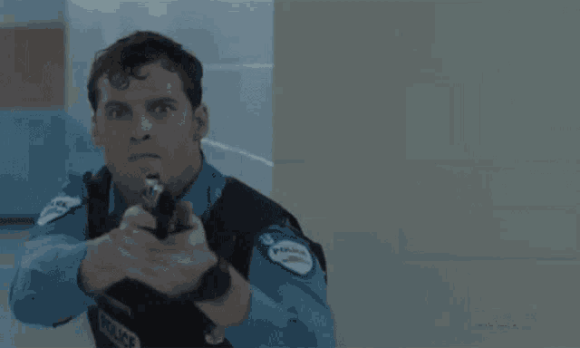 a blurry picture of a man holding a gun with bravo written on the bottom