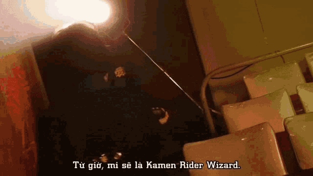 a person holding a sword with the words kamen rider wizard written below them