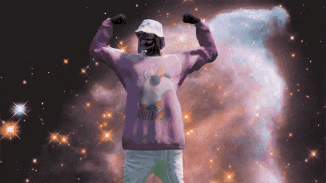 a person wearing a purple sweatshirt that says queen