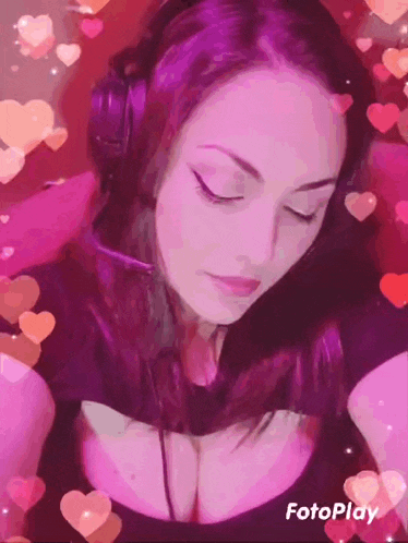 a woman wearing headphones is surrounded by hearts and the word fotoplay is on the bottom