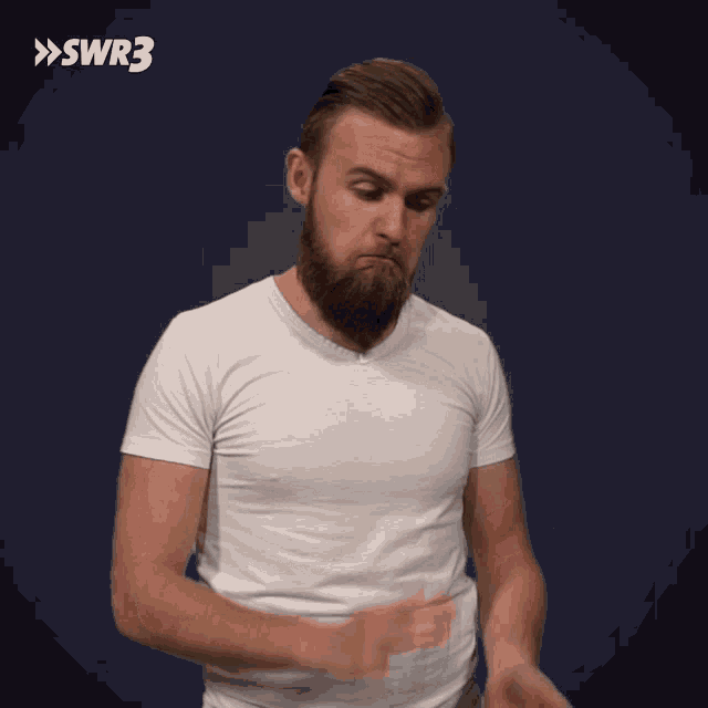 a man with a beard wearing a white t-shirt with swr3 on the bottom