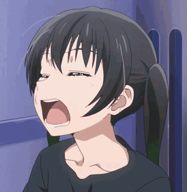 a close up of a girl making a funny face with her mouth open