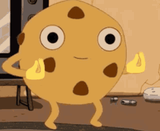 a cartoon cookie with arms and legs is standing on a floor .