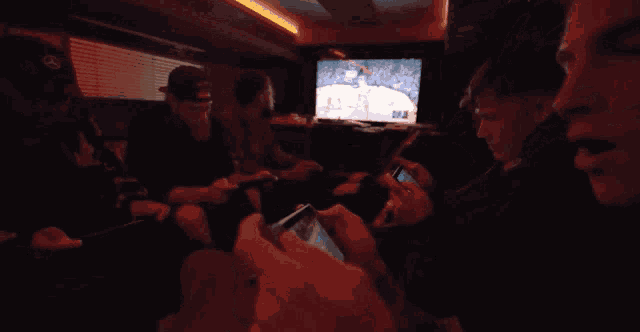 a group of people playing a game on their cell phones