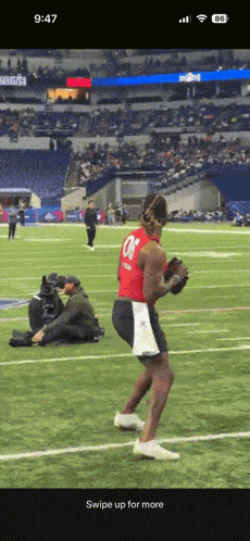 a football player wearing a red jersey with the number 08 on it