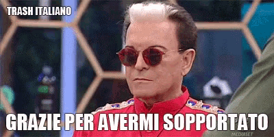 a man wearing sunglasses and a red shirt says trash italiano grazie per avermi supportato