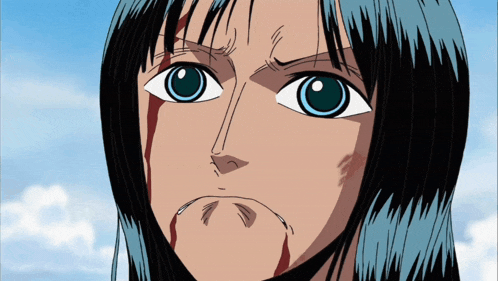 a close up of a person 's face with blood coming out of their mouth