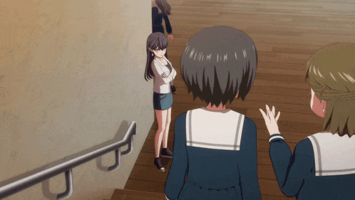 a girl in a school uniform stands on a set of stairs talking to two other girls