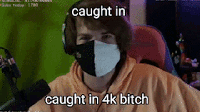 a man wearing a mask with the words caught in caught in 4k bitch written on it