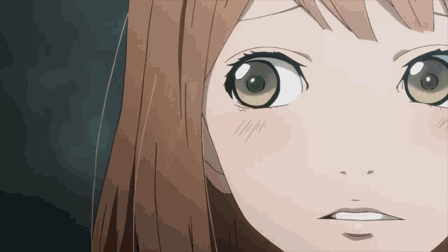 a close up of a girl with green eyes