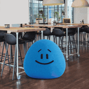 a large blue ball with a smiley face on it