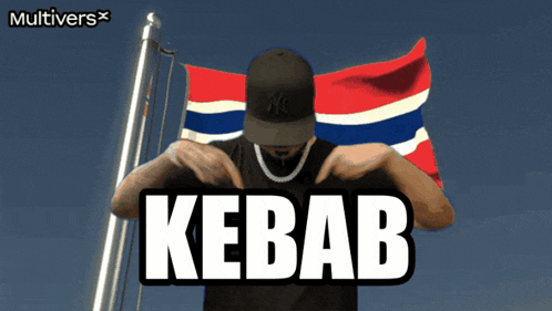 a man wearing a ny hat stands in front of a flag with the word kebab on it