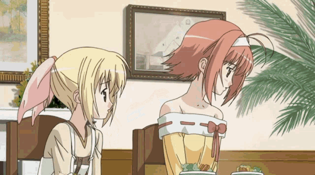 two anime girls sit at a table with plates of food in front of them