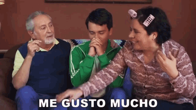 a group of people sitting on a couch with the words me gusto mucho written on the bottom