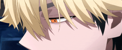 a close up of a person 's face with yellow hair and red eyes