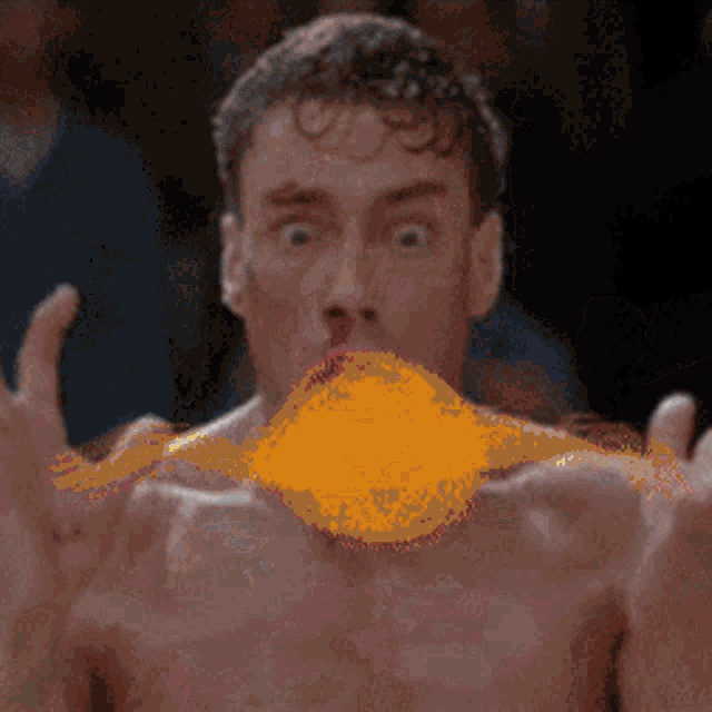 a man without a shirt is blowing a yellow balloon in his mouth