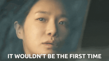a close up of a woman 's face with the words " it wouldn 't be the first time " above her