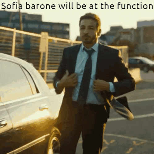 a man in a suit and tie is standing in front of a car with the words sofia barone will be at the function below him