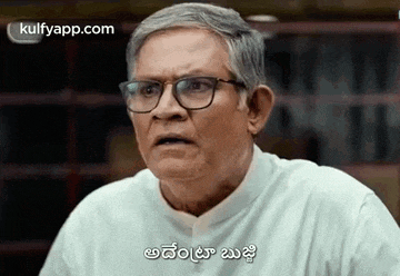an older man wearing glasses and a white shirt is making a funny face in a library .