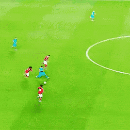 a group of people are playing soccer on a field