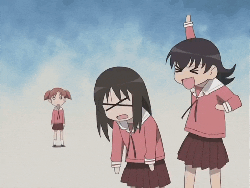 a girl with a red hat on her head is standing next to another girl